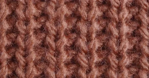The texture of the knitted part is close-up. Macro fragment. Terracotta Видео 166084126
