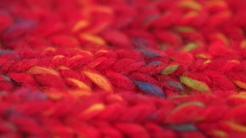 Texture knitted red woolen fabric made natural wool closeup. rotation. macro. Stock Footage 241927410