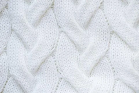 Texture knitted white sweater, drawing large braid spokes, Stock Photos