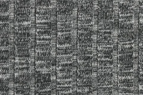 The texture of a knitted wool gray. texture jersey. Stock Photos