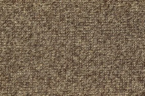 The texture of a knitted wool mix beige brown. Stock Photos