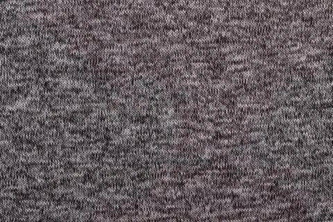 Texture of knitted woolen fabric Stock Photos
