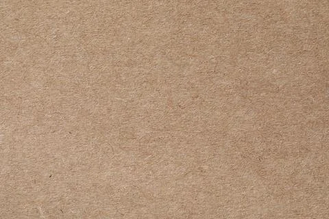 Texture of kraft paper sheet as background, closeup Stock Photos