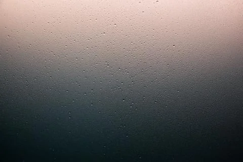 Texture of large and small drops of water on a matte surface Stock Photos