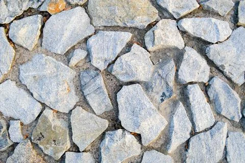 Texture of large gray sharp stones. The background Stock Photos