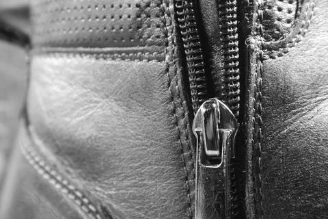 Texture of leather brown boot with zipper and rough seam Stock Photos