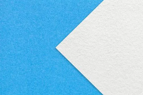 Texture of light blue paper background, half two colors with white arrow. Stockfoto's
