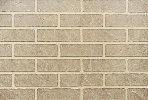 Texture of a light brown brick wall for background. Stock Photos