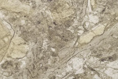 Texture of light brown marble with pattern, macro background. Olive stone bac Stock Photos