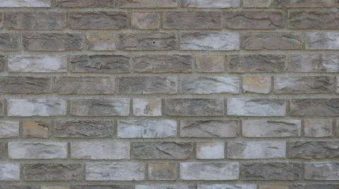 Texture of light-colored embossed decorative brick Stock Photos