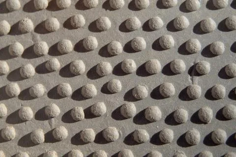The texture of a light gray rubber surface with bulges.  background with irre 写真素材