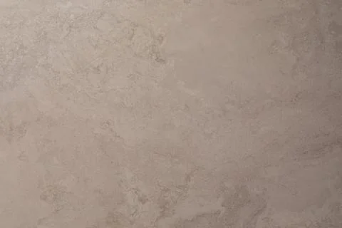 Texture of light gray stone surface with subtle variations and patterns for Stock Photos