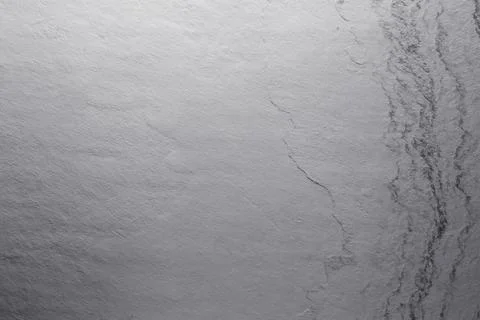 Texture of light grey stone surface as background, closeup Stock Photos