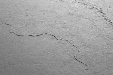 Texture of light grey stone surface as background, closeup Stock Photos