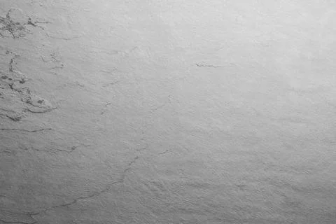 Texture of light grey stone surface as background, closeup Stock Photos