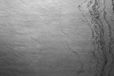 Texture of light grey stone surface as background, closeup Stock Photos