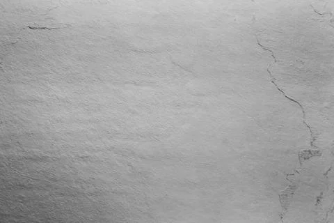 Texture of light grey stone surface as background, closeup Stock Photos