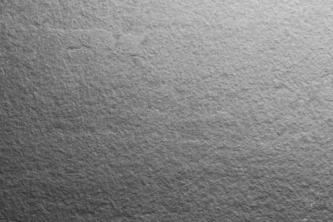 Texture of light grey stone surface as background, closeup Stock Photos