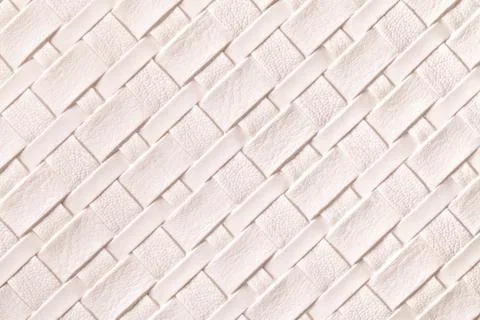 Texture of light pink leather background with wicker pattern, macro. Stock Photos