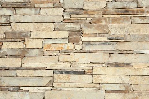 Texture of light stone wall as background Stockfoto's