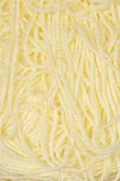 Texture of light yellow knitting yarn Stock Photos