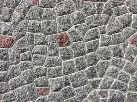 Texture lined with stone on the wall, of different shapes and shades Foto stock