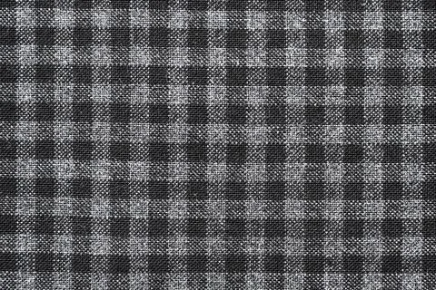 The texture of linen fabric in a large cell of black and white. Scottish ta.. Stockfoto's
