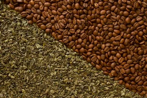 Texture with loose leaf green tea and coffee beans, top view. Stock Photos