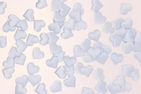 Texture made of blue textile confetti in a heart shape. Stock Photos