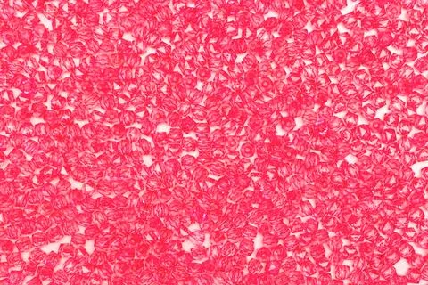 Texture made from pink acrylic square beads. Stock Photos