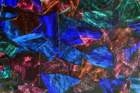 Texture of many pieces of torn paper. Shreds of torn colored paper. Puzzle. Stock Photos