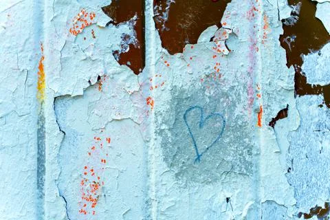 Texture. Many times painted surface with peeling paint. A heart is drawn. Stock Photos