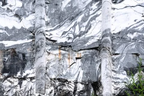 The texture of a marble rock with cracks, a pattern in the form of stripes fr Stock Photos