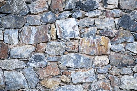 The texture of masonry. Background of surface of multicolored stones. Foto stock
