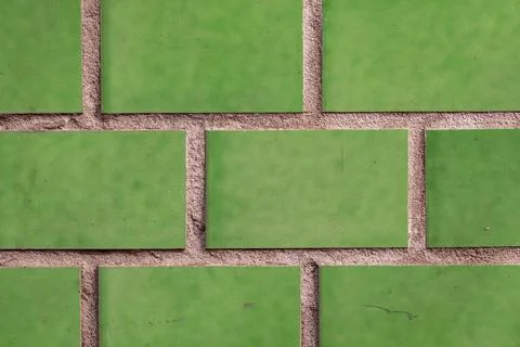 The texture of the masonry of green ceramic tiles. rustic background Stock Photos
