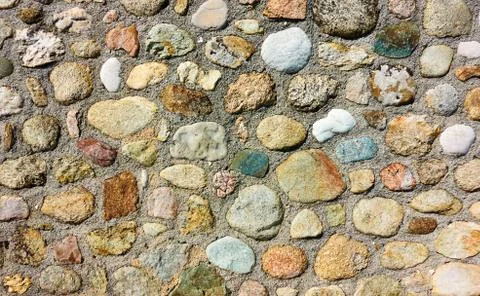Texture of masonry of rounded stones Stock Photos