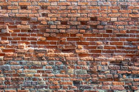 Texture of masonry, a wall built of different bricks Stock Photos