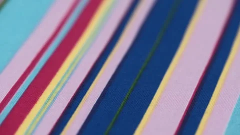 Texture material multicolored stripes. rotating striped cotton fabric closeup. Video stock 256414186