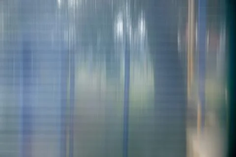 Texture of matte translucent plexiglass with stripes, glare, and reflections. Stock Photos