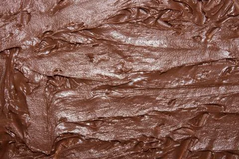 The texture of the melted chocolate top view.Background of melted chocolate. Stock Photos