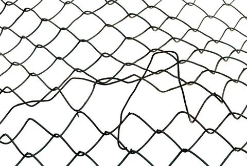 The texture of the metal mesh. Torn, destroyed, broken metal mesh on a whit.. Stock Photos