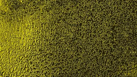 Texture of the metal surface of a wall made of non-ferrous metal. Stock Photos