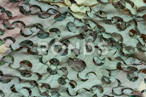 Texture military camouflage nets or green leaf camouflage for background Stock Photos
