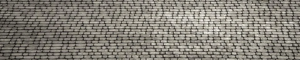 The texture of a monotonous tiled pavement with perspective. Stock Photos