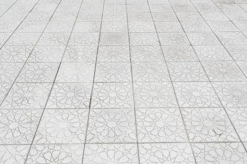 The texture of a monotonous tiled pavement with perspective. Abstract backg.. Stock Photos