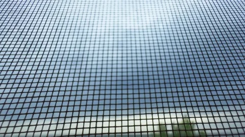 Texture of mosquito net against sky, slight camera movement. Stock Footage 273030022