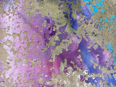 Texture of a multi-colored stone wall. Cracked paint on a concrete wall Stock Photos
