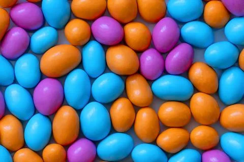 Texture with multi-colored stones. objects of different colors on a green b.. Stock Photos