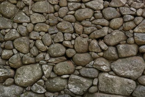 Texture of a natural drystone retaining wall. Фото