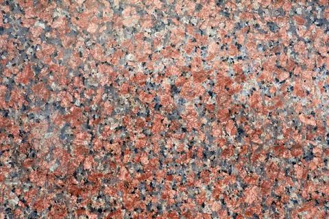 The texture of natural polished granite. Pattern, background. Stock Photos